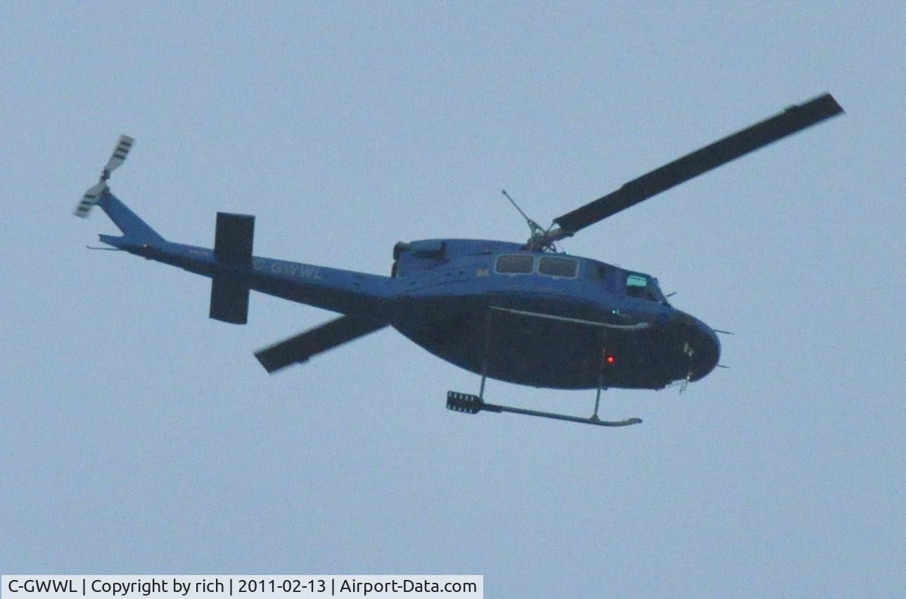 C-GWWL, 1979 Bell 212 C/N 30702, Flying ESE over North Burnaby (49.269,-123.009)  2011-Feb-13 08:35h
