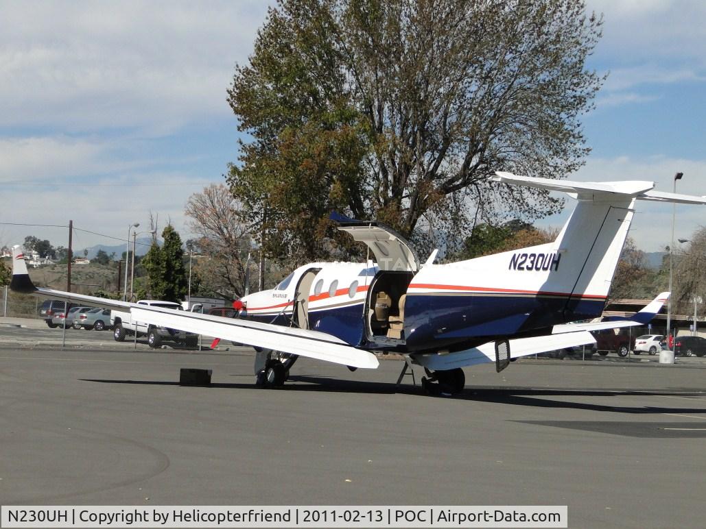 N230UH, 1998 Pilatus PC-12/45 C/N 230, Plane parked in transient parking and being wiped down