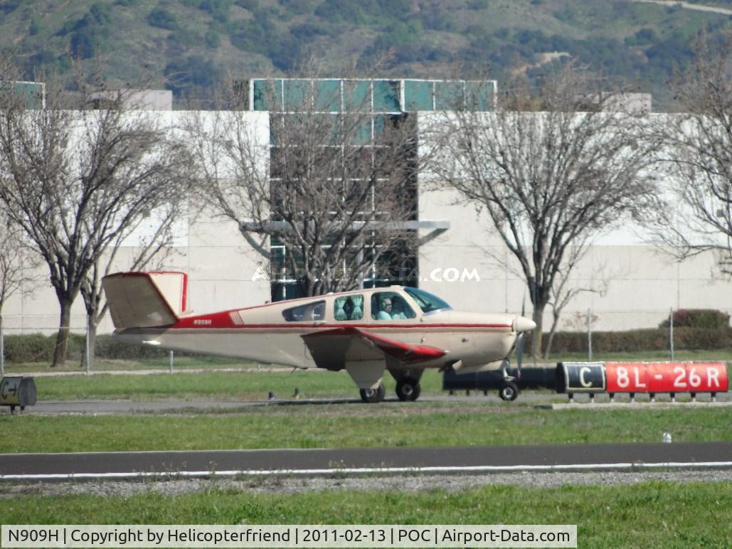 N909H, 1956 Beech G35 Bonanza C/N D-4658, Just landed on runway 8R and is taxiing to Howards Aviation area