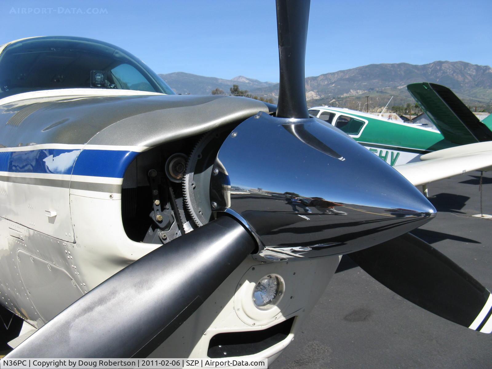 N36PC, 1979 Beech A36 Bonanza 36 C/N E-1528, 1979 Beech A36 BONANZA Machen Turbo Lycoming TIO-540-J conversion 350 Hp, the starter geared wheel seen and custom bump cowl cover reveals a Lycoming engine within, not a standard Continental IO-520