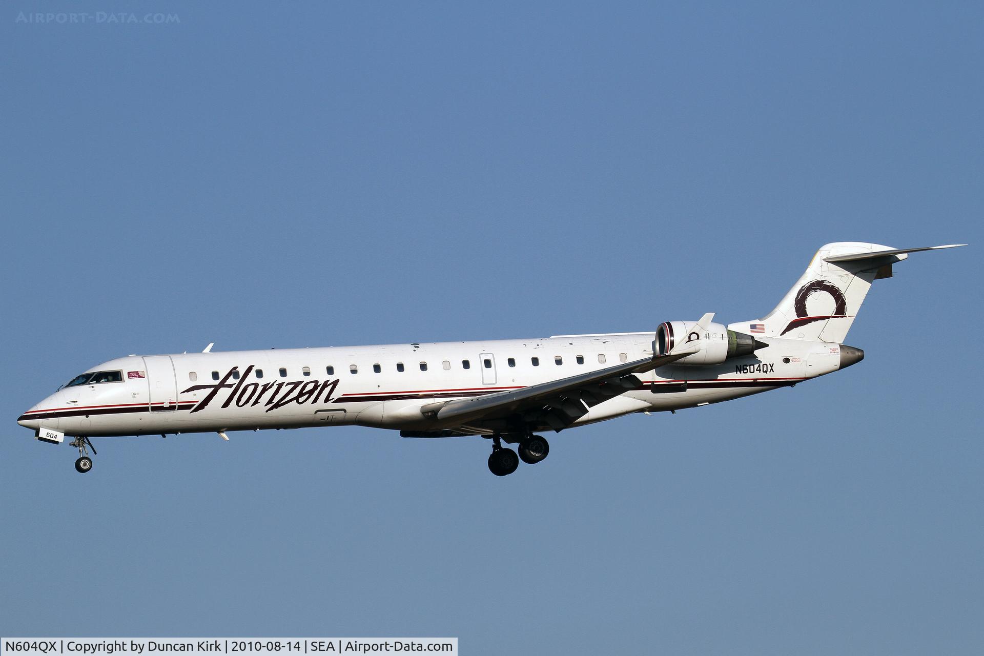 N604QX, 2001 Bombardier CRJ-701 (CL-600-2C10) C/N 10019, Landing on 34L