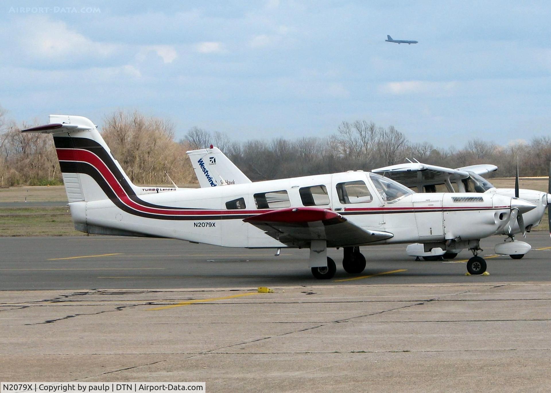 N2079X, 1979 Piper PA-32RT-300T Turbo Lance II C/N 32R-7987120, At Downtown Shreveport. Also a B-52 on final for Barksdale Air Force Base in the distance.