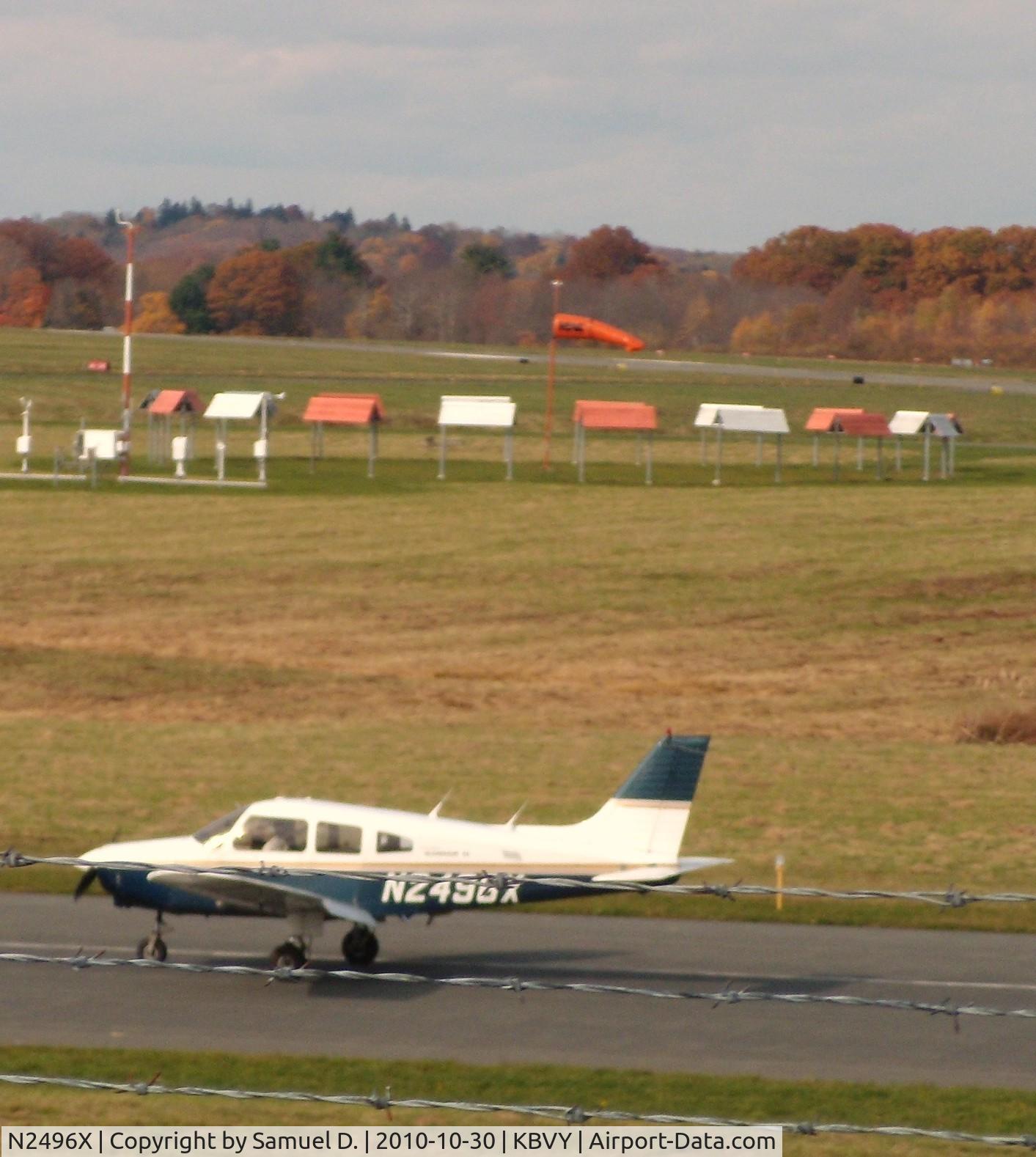 N2496X, 1985 Piper PA-28-161 C/N 28-8516071, Infront of wind sock on runway 27 at KBVY.