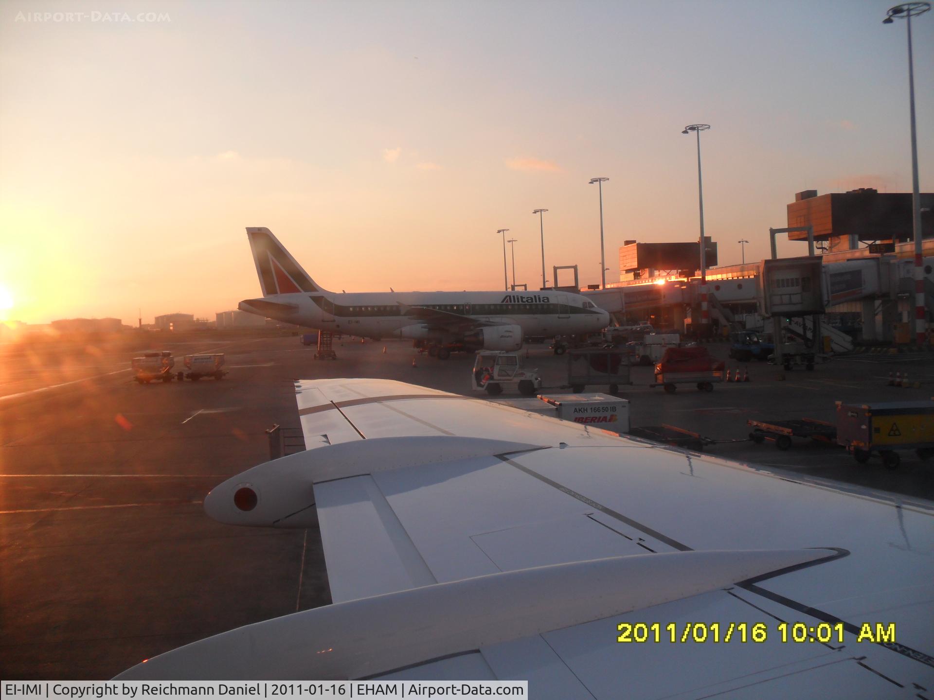 EI-IMI, 2002 Airbus A319-112 C/N 1745, Shortly after landing in Amsterdam, docking Gate B13 with nice sun rise in the background!