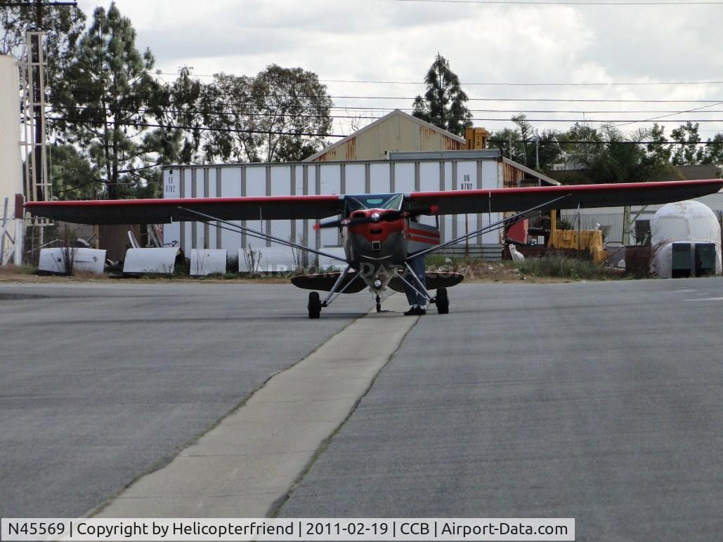 N45569, 1946 Luscombe 8A C/N 2096, Parked betweenn the hangers and warming up
