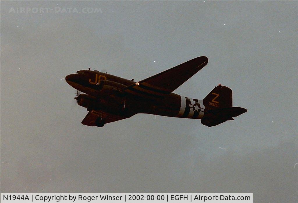 N1944A, 1944 Douglas DC3C-S1C3G (C-47A) C/N 19677, Poor photograph of Wings Venture's Skytrain coded J8/Z seen departing Swansea Airport summer 2002?