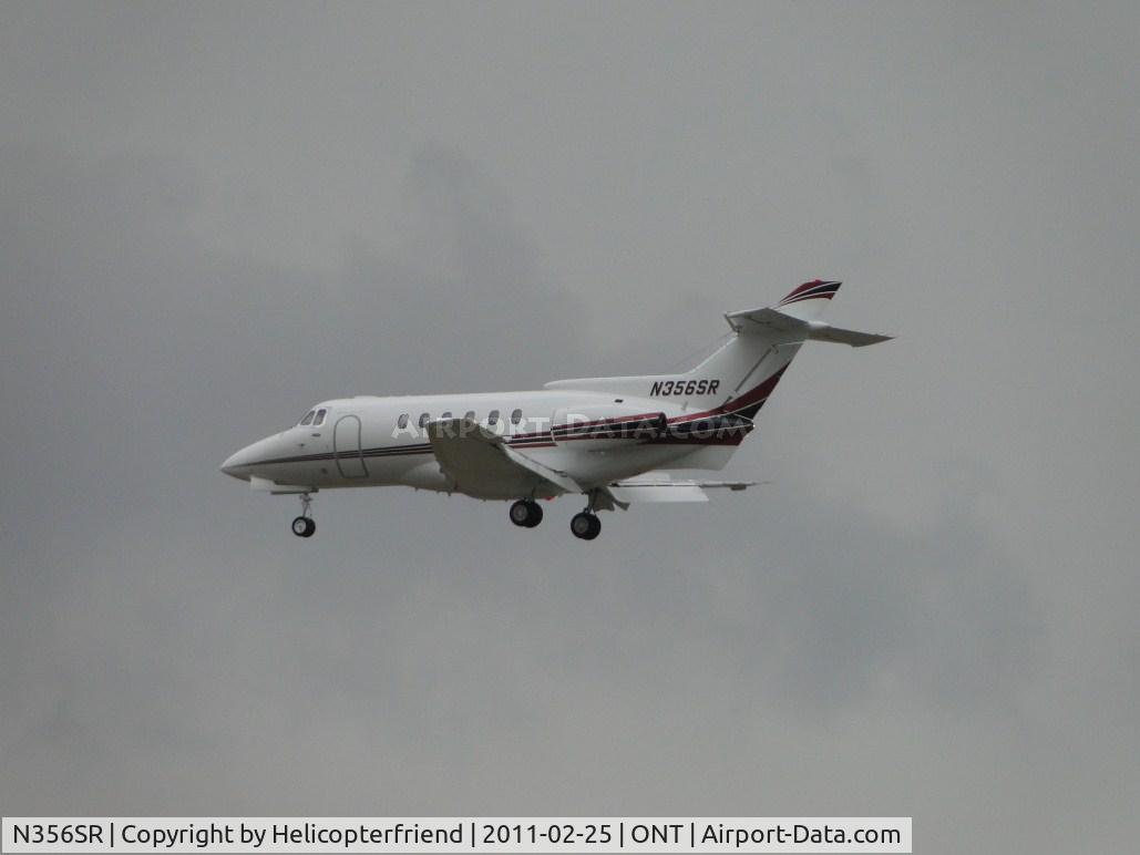 N356SR, 2003 Raytheon Hawker 800XP C/N 258620, On final for 26 on a rainy, cloudy day