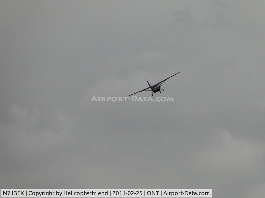 N713FX, 1995 Cessna 208B C/N 208B0438, Turning from base leg to final for runway 26R