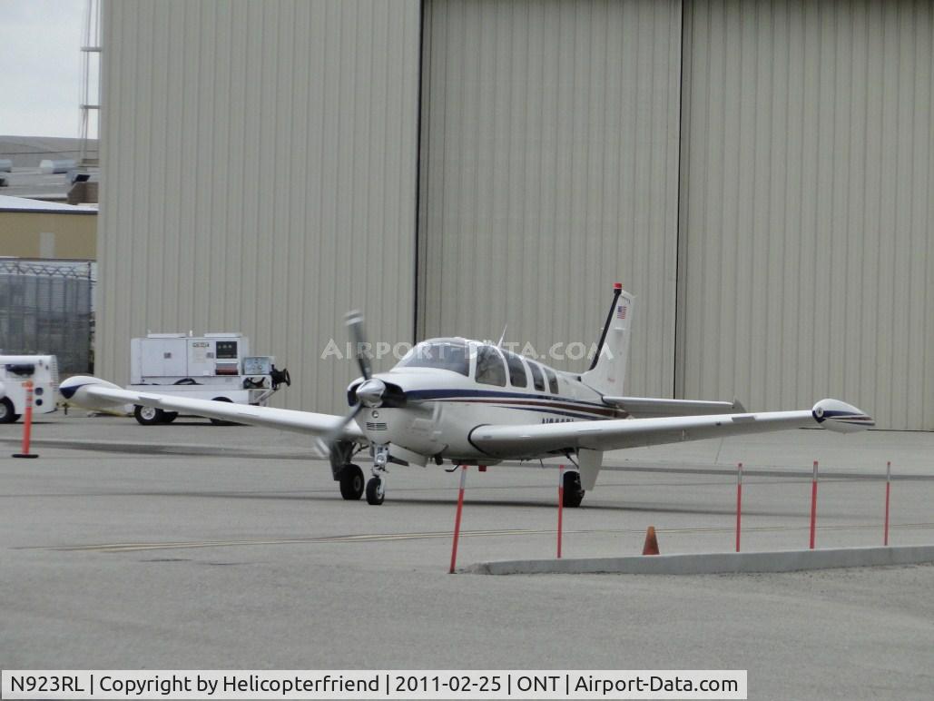 N923RL, Raytheon Aircraft Company A36 Bonanza C/N E3537, Taxiing out of the south parking area heading towards runway 26