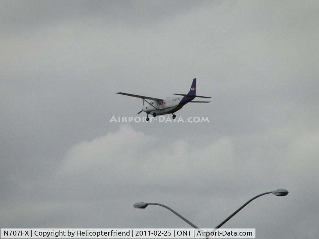 N707FX, 1995 Cessna 208B Grand Caravan C/N 208B0427, Over the outer fence for runway 26R