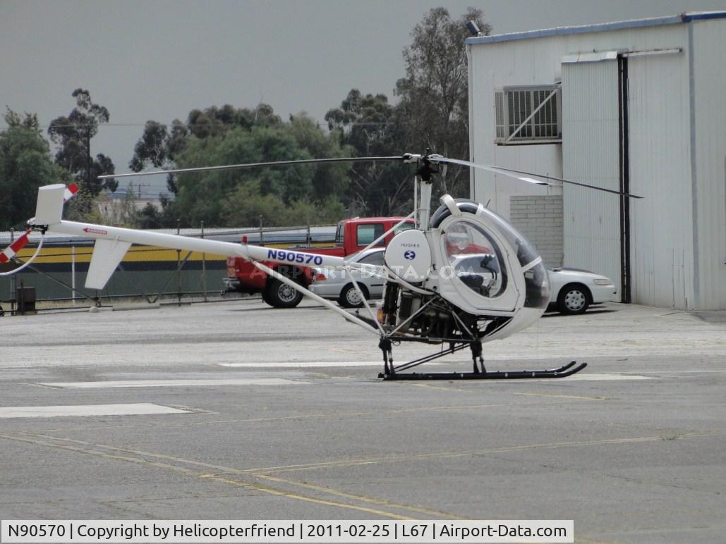 N90570, Hughes 269C C/N 1180736, Parked outside of in the area by Mercy Air parking