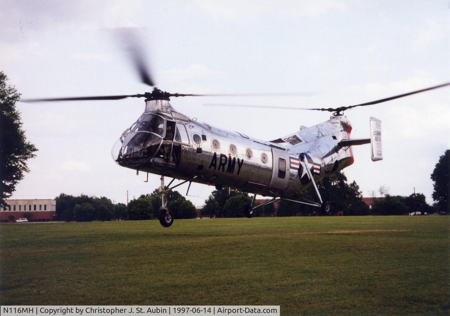 N116MH, 1956 Vertol CH-21C Shawnee C/N C.278, CH-21C 56-2116 N116MH hovers over the parade field at Rt. Rucker, AL.  Acft flown from Springdale, AR to Ft. Rucker for 1997 Army Warrant Officer Convention.