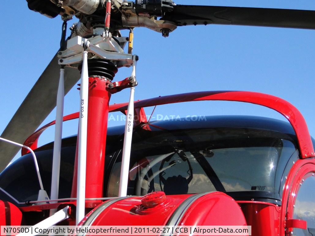N7050D, Hughes 269A C/N 56-0551, Appears to have a spoiler on top, not sure if it's to deflect the air down over the engine