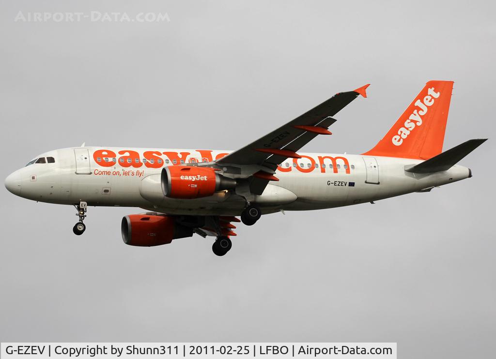 G-EZEV, 2004 Airbus A319-111 C/N 2289, Landing rwy 32L with 'Come On, Let's Fly' titles