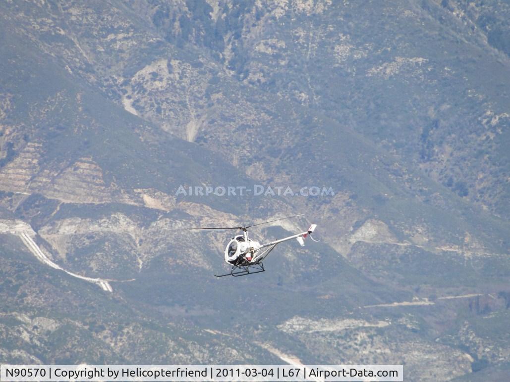 N90570, Hughes 269C C/N 1180736, Heading northwesterly towards the mountains