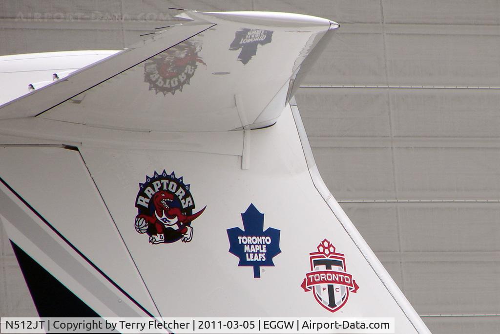 N512JT, 2004 Gulfstream Aerospace GIV-X (G450) C/N 4005, Tail logo of G550 at London Luton - in town for the first ever regular season NBA Major League Basketball match in London UK  - Toronto Raptors v New Jersey Nets - pretty clear who this guy is supporting