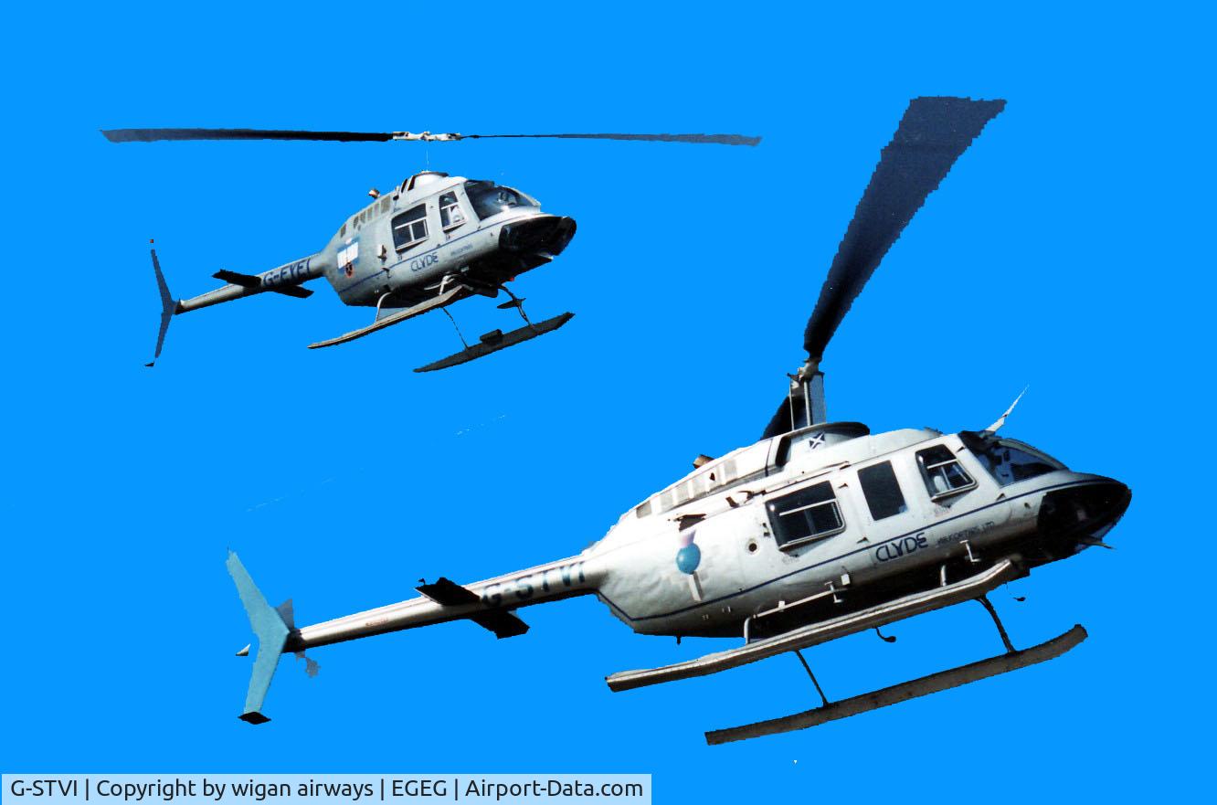 G-STVI, 1981 Bell 206L-1 LongRanger II C/N 45229, sharing the sky with her pal G-EYEI