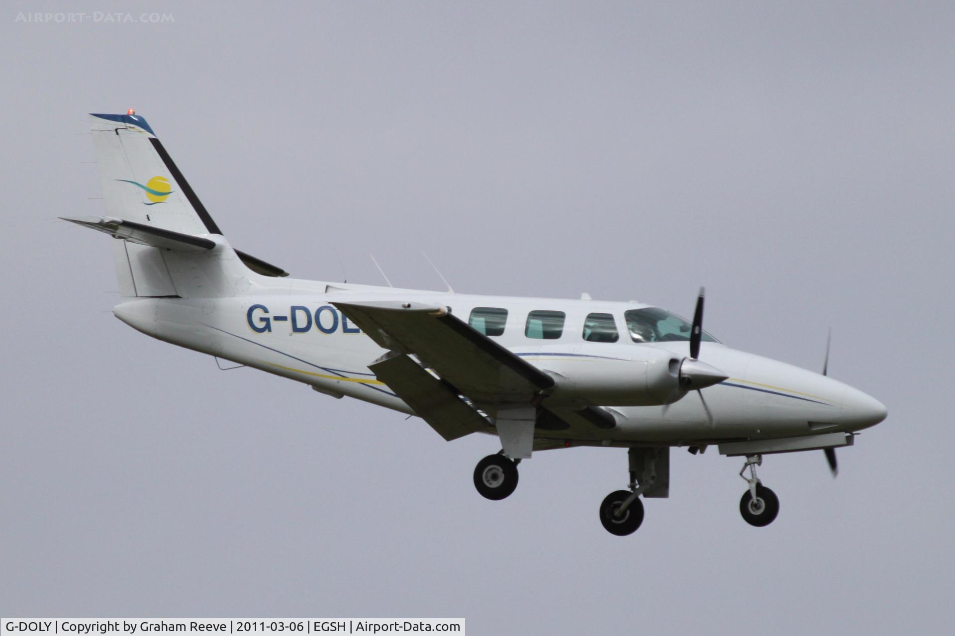 G-DOLY, 1982 Cessna T303 Crusader C/N T303-00107, On finals.