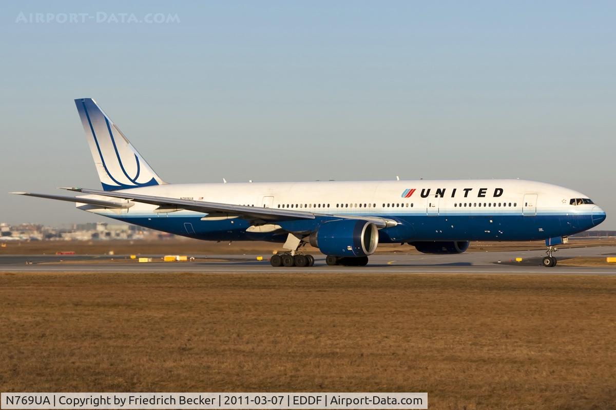 N769UA, 1995 Boeing 777-222 C/N 26921, departing via RW18W