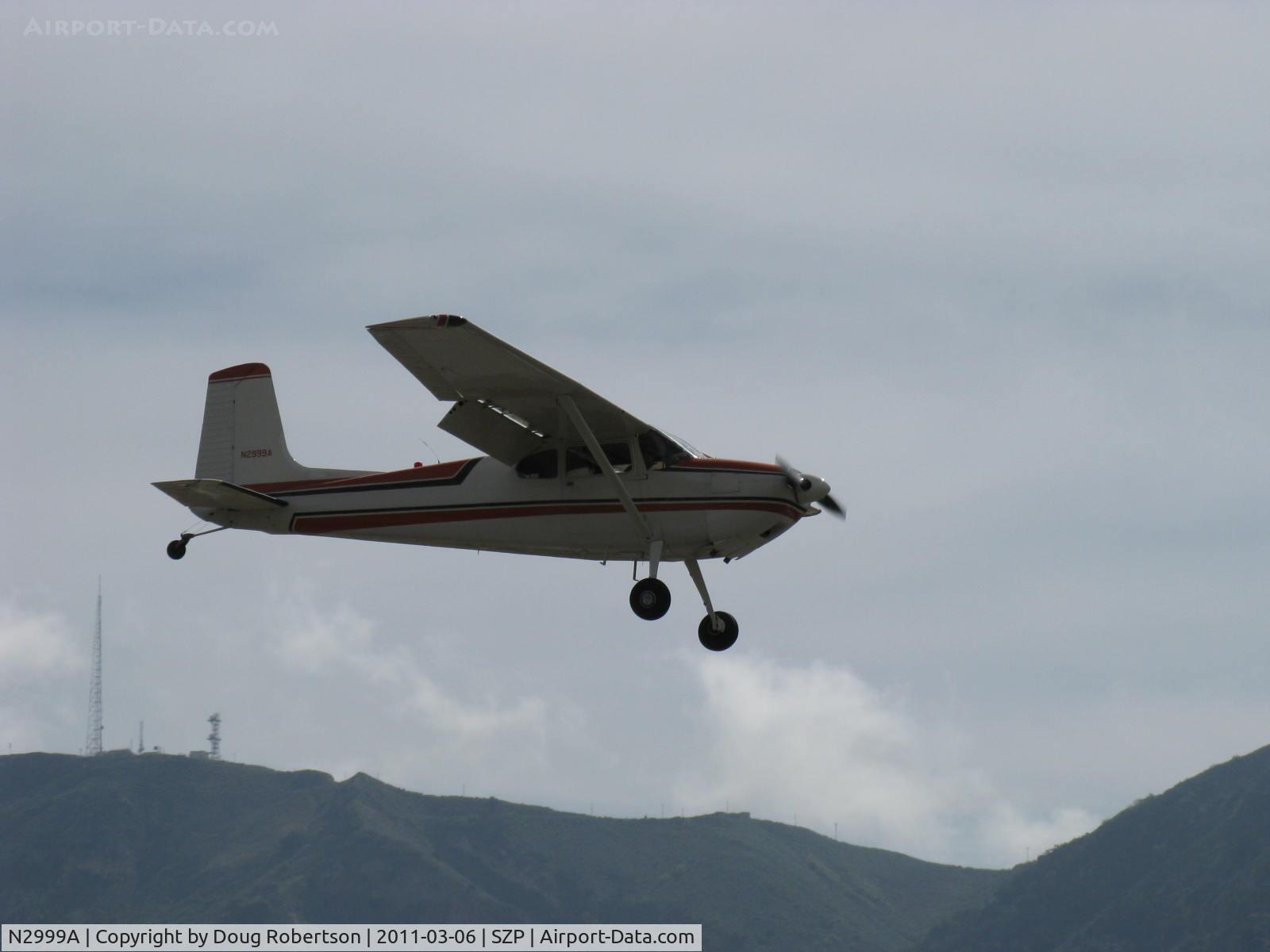 N2999A, 1953 Cessna 180 C/N 30199, 1953 Cessna 180, Continental O-470-A 225 Hp, on final for STOL landing Rwy 22L grass