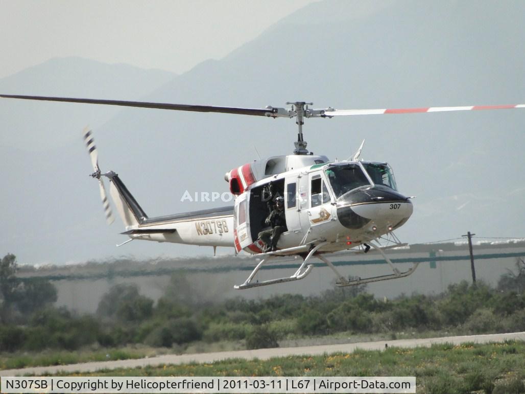 N307SB, 1975 Bell 212 C/N 30781, Deputy getting ready for training exercise