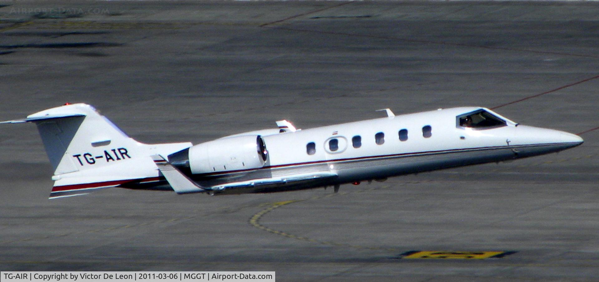 TG-AIR, 2010 Learjet 60 C/N 377, taking off from La Aurora int. airport at Guatemala city. this photo was taken from the roof top of the Crown Planza hotel.