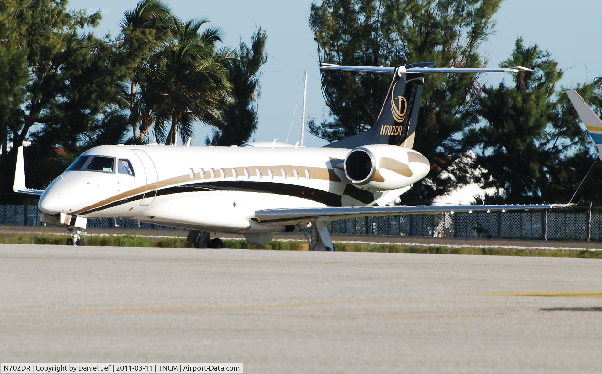 N702DR, 2005 Embraer EMB-135BJ Legacy C/N 14500925, N702DR park on the main ramp at TNCM