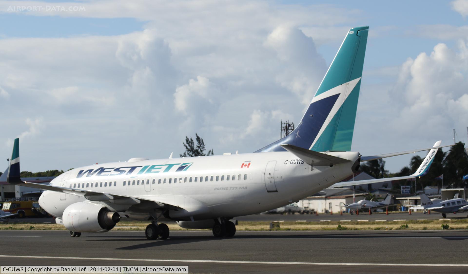 C-GUWS, 2002 Boeing 737-76N C/N 33378, Westjet back tracking the active for parking at TNCM