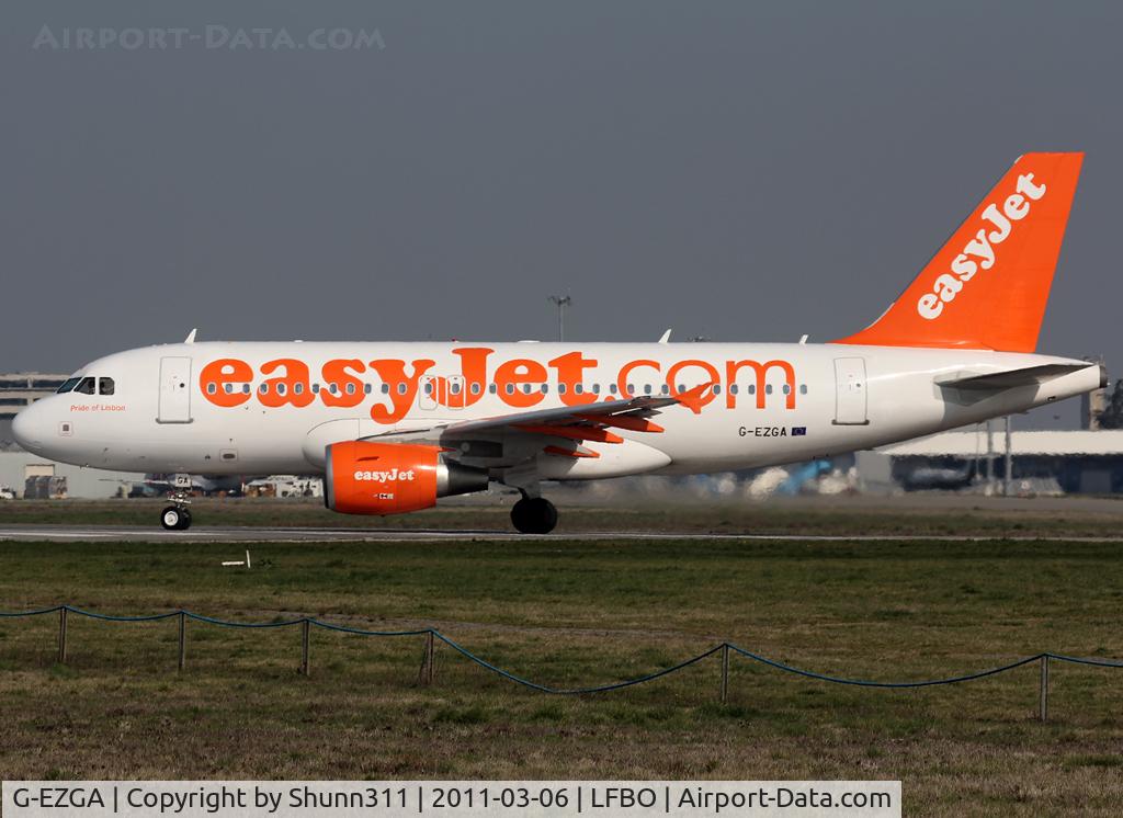 G-EZGA, 2010 Airbus A319-111 C/N 4427, Lining up rwy 32R for departure... Additional 'Pride of Lisbon' titles