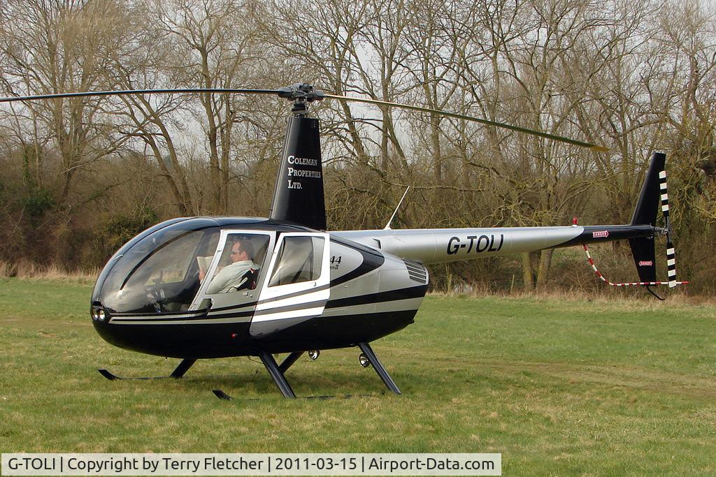 G-TOLI, 2007 Robinson R44 Raven II C/N 12009, Visitor to Day 1 of the 2011 Cheltenham Horseracing Festival