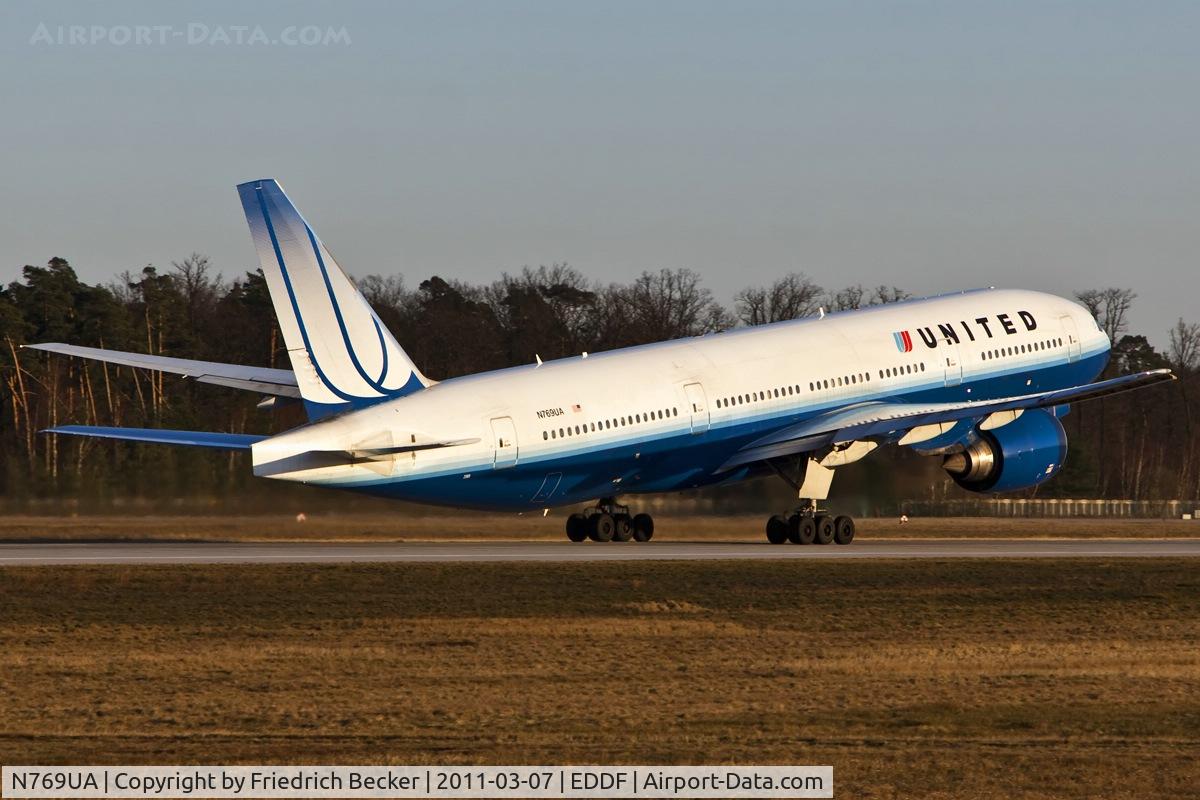 N769UA, 1995 Boeing 777-222 C/N 26921, departing via RW18W