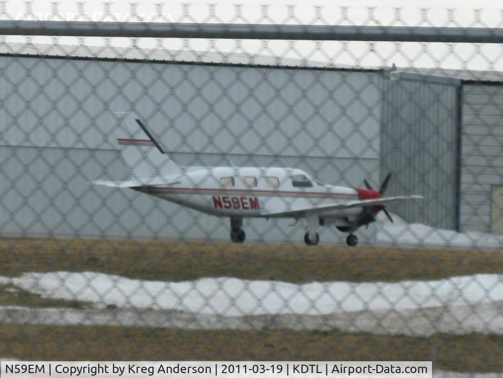 N59EM, 1984 Piper PA-46-310P Malibu C/N 46-8508022, Taken while driving down Airport Road. Piper PA-46-310P Malibu.