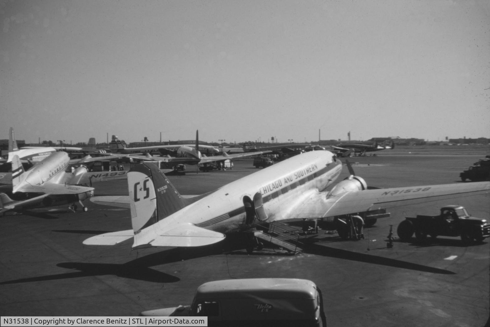 N31538, Douglas DC-3 C/N 6317, Picture taken at St. Louis Lambert Field in 1955.  Note Delta C&S service truck in the foreground.