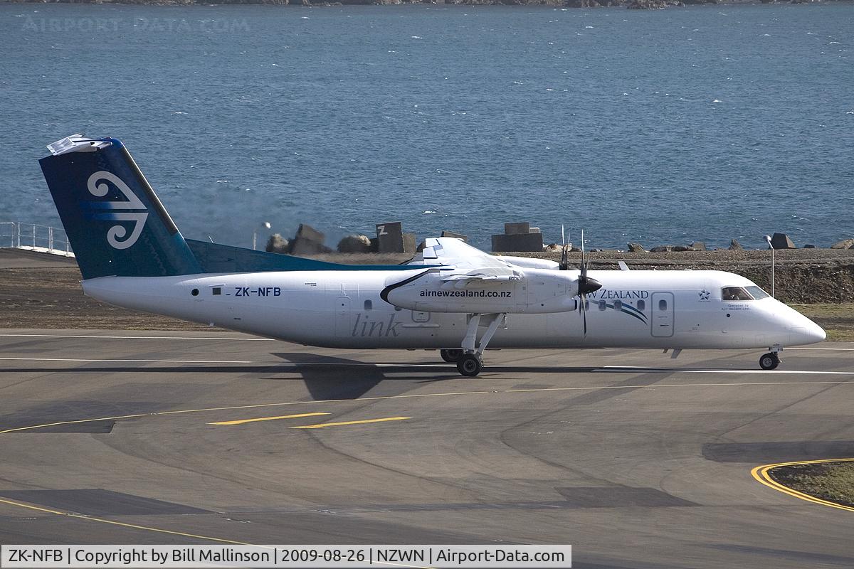 ZK-NFB, 2009 De Havilland Canada DHC-8-311 Dash 8 C/N 670, ready to depart into a strong Welly wind.