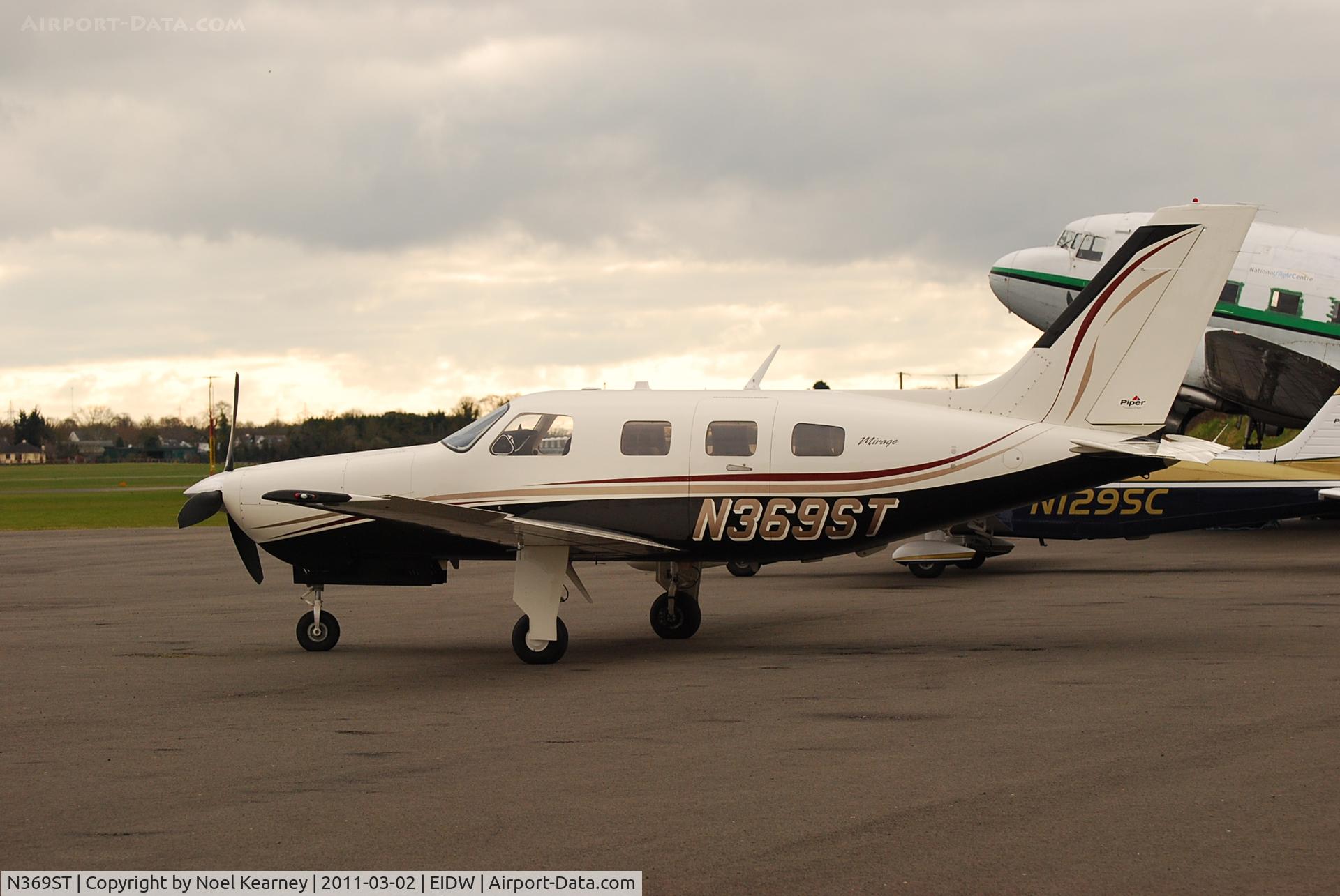 N369ST, 2006 Piper PA-46-350P Malibu Mirage C/N 4636396, Parked on the ramp at Weston.