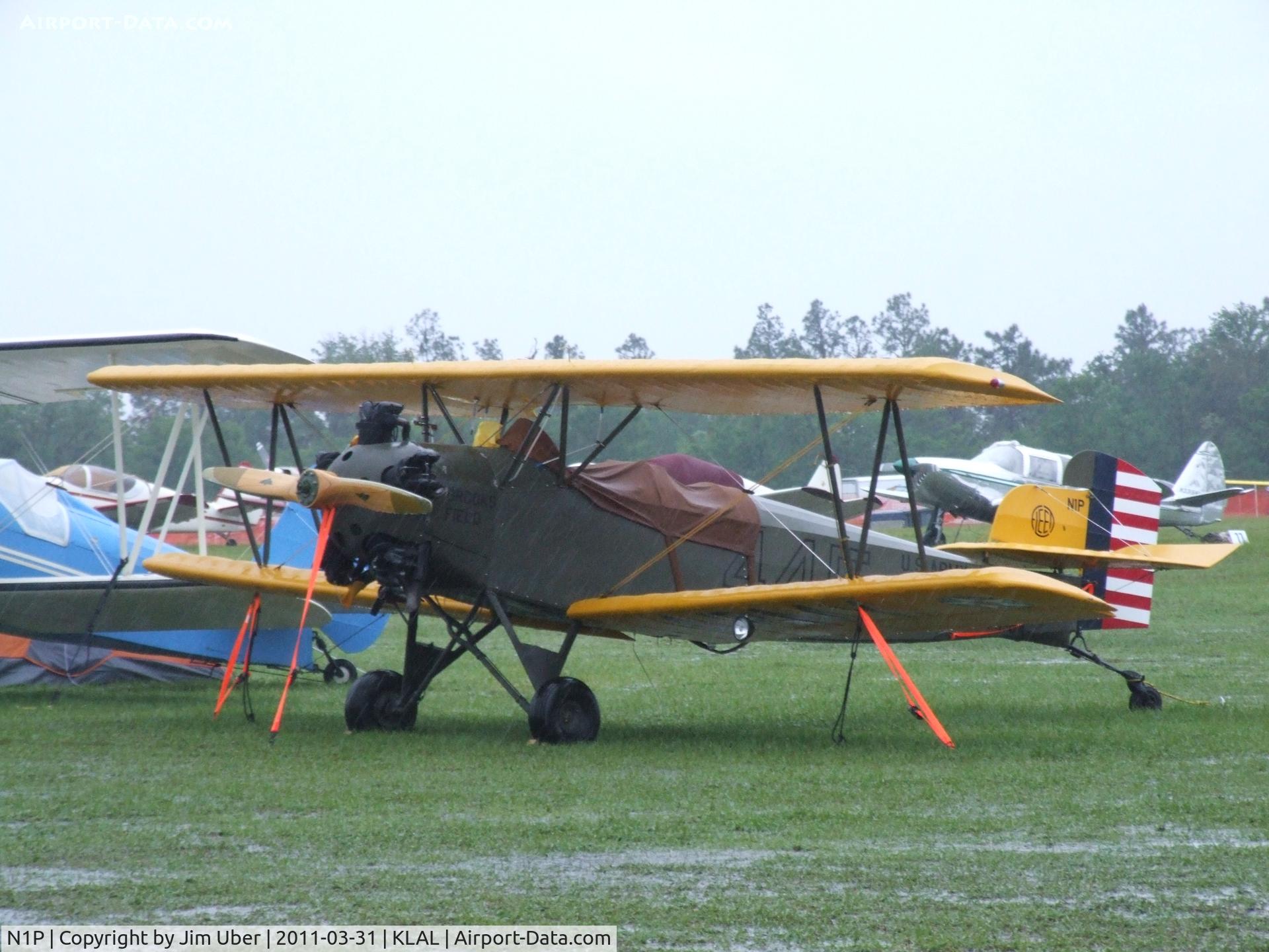 N1P, Fleet Model 2 C/N 325, I had to check on Mark's Fleet, as the tornado had just rolled through... The rain was still torrential, but the old girl was still tied down OK.A few of the other vintage planes didn't do so good.