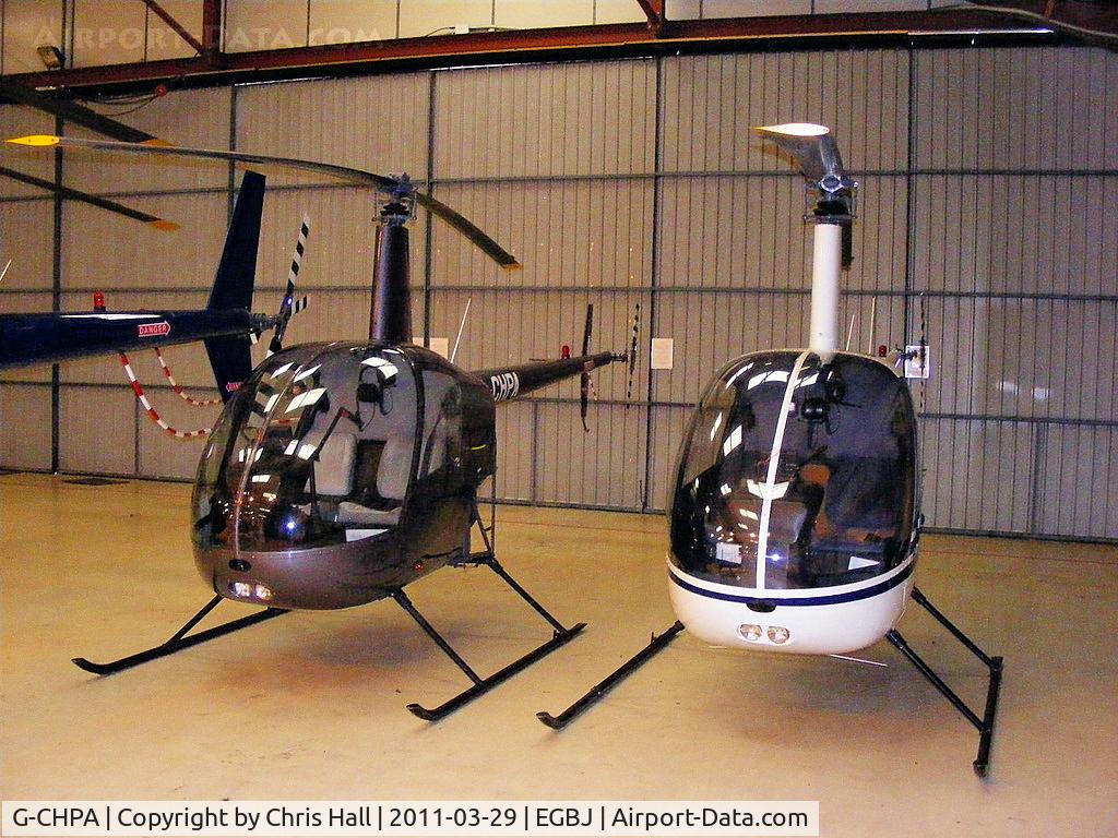 G-CHPA, 2003 Robinson R22 Beta II C/N 3442, next to G-BXUC