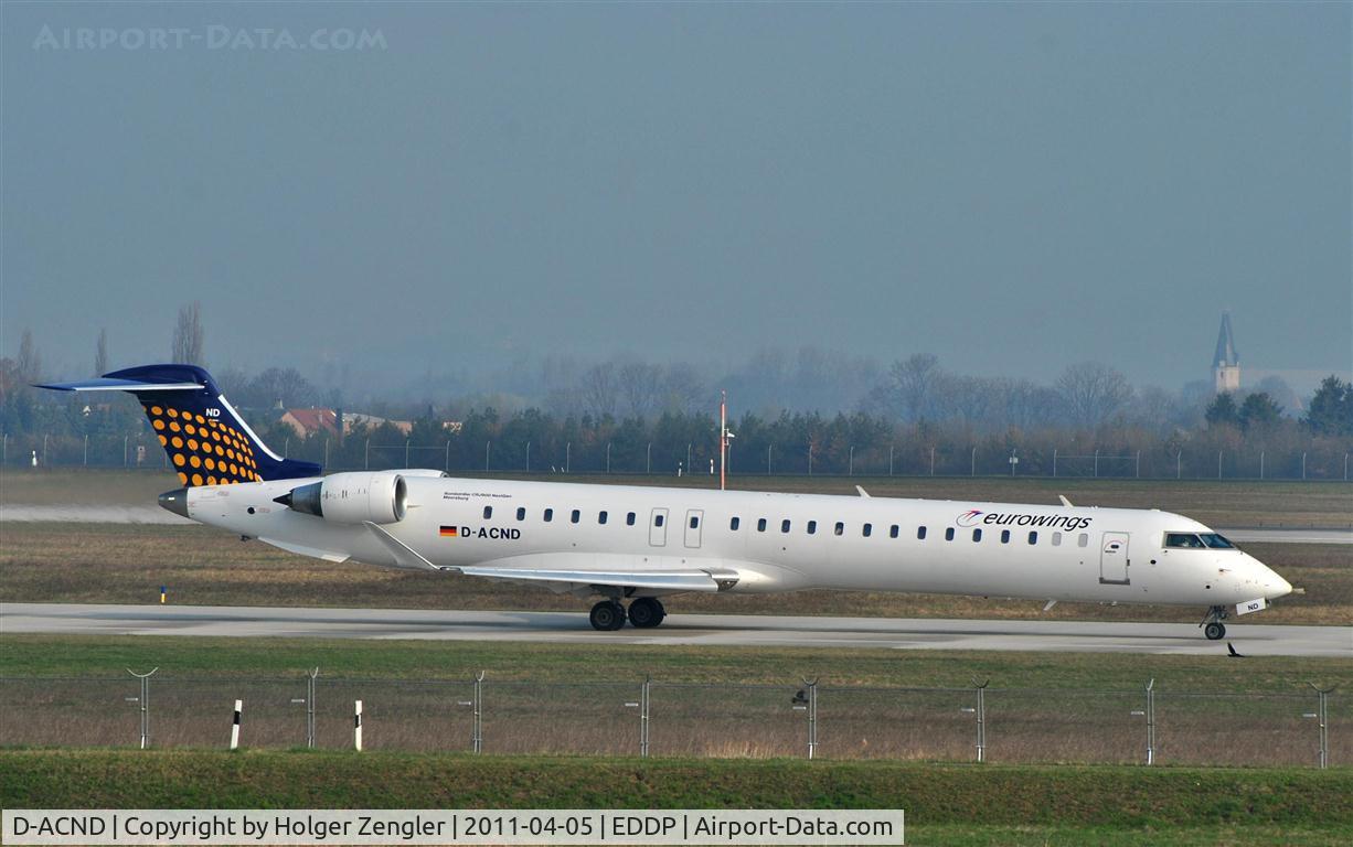 D-ACND, 2009 Bombardier CRJ-701 (CL-600-2C10) Regional Jet C/N 15238, Taxiing along 07L straight to 26R.