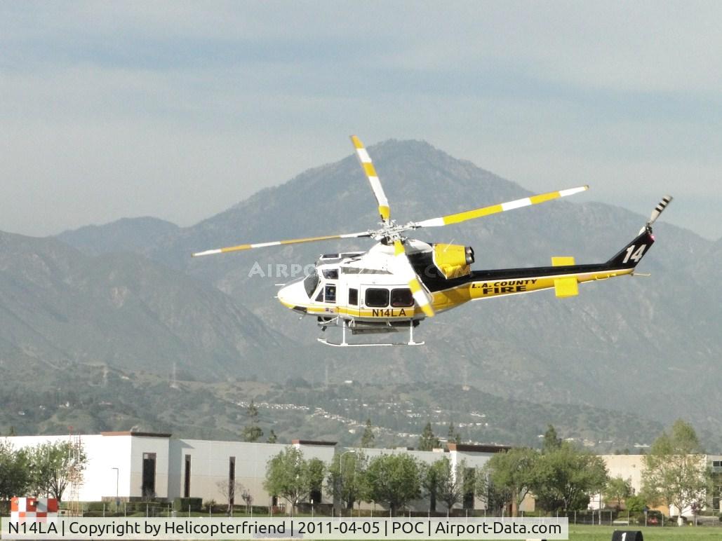 N14LA, 2005 Bell 412EP C/N 36393, After air taxiing on taxiway Coco, Copter 14 turns a sharp left at runway 26 to head westbound on a call for service