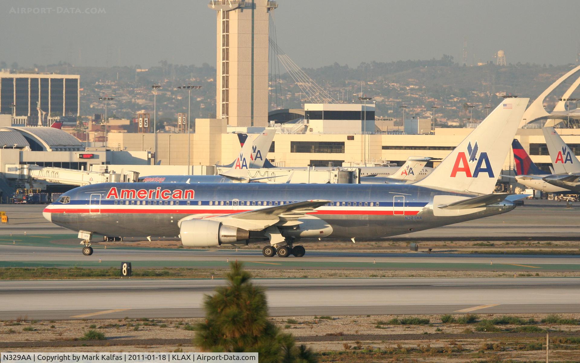 N329AA, 1987 Boeing 767-223 C/N 22329, American Airlines Boeing 767-223 , AAL117 arriving from KJFK, off of RWY 25L on TWY H.