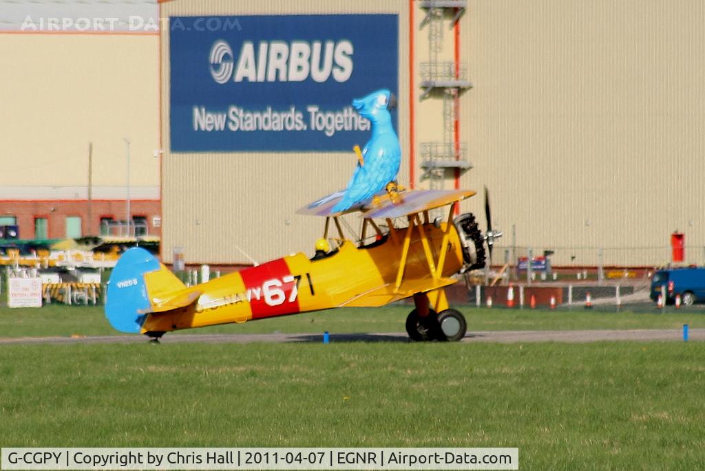 G-CGPY, 1945 Boeing E75N1 C/N 75-5303, promoting the new animated film 'Rio' taking 'Blu' wingwalking