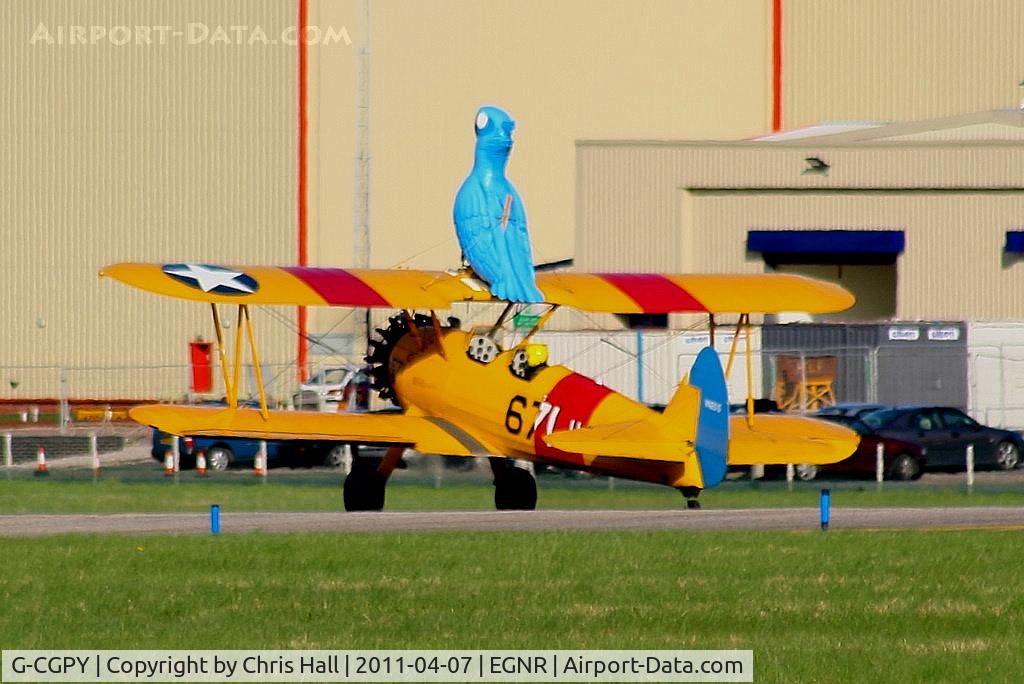 G-CGPY, 1945 Boeing E75N1 C/N 75-5303, promoting the new animated film 'Rio' taking 'Blu' wingwalking