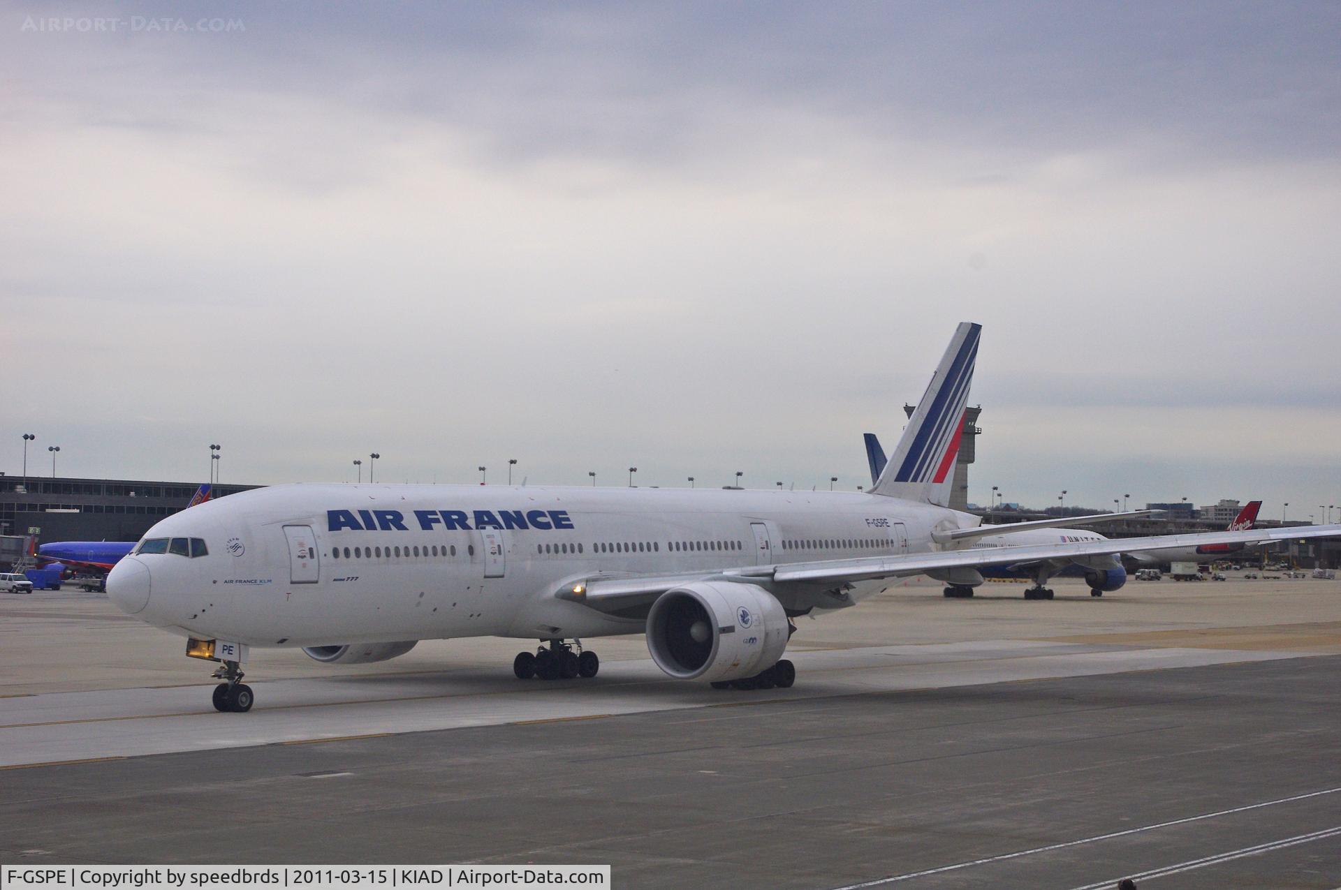 F-GSPE, 1999 Boeing 777-228/ER C/N 29006, A rather dirty Air France Triple Seven taxiing for departure taken from on board Aer Lingus in seat 37A.