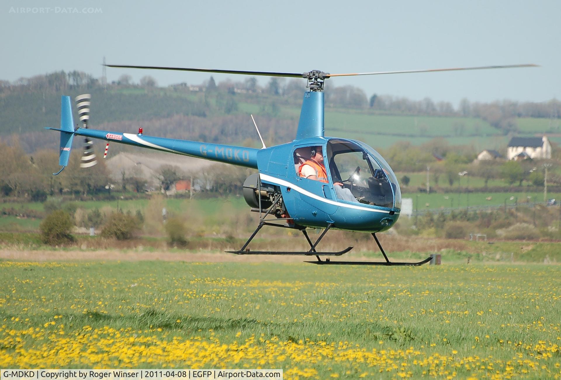 G-MDKD, 1990 Robinson R22 Beta C/N 1247, Arriving Pembrey Airport. Operated by Heli-air Wales based at Swansea Airport.
