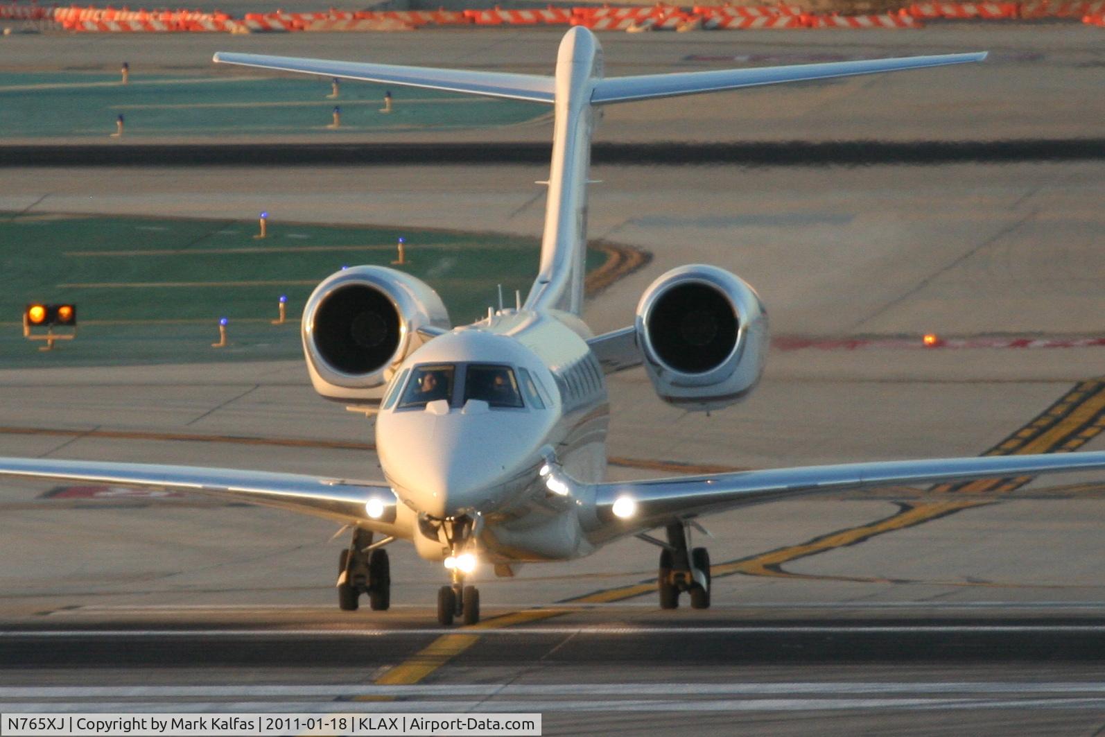 N765XJ, 2006 Cessna 750 Citation X Citation X C/N 750-0265, XOJET Cessna 750 Citation X, XOJET 765 crossing RWY 25L on TWY T KLAX, arriving from KSJC.