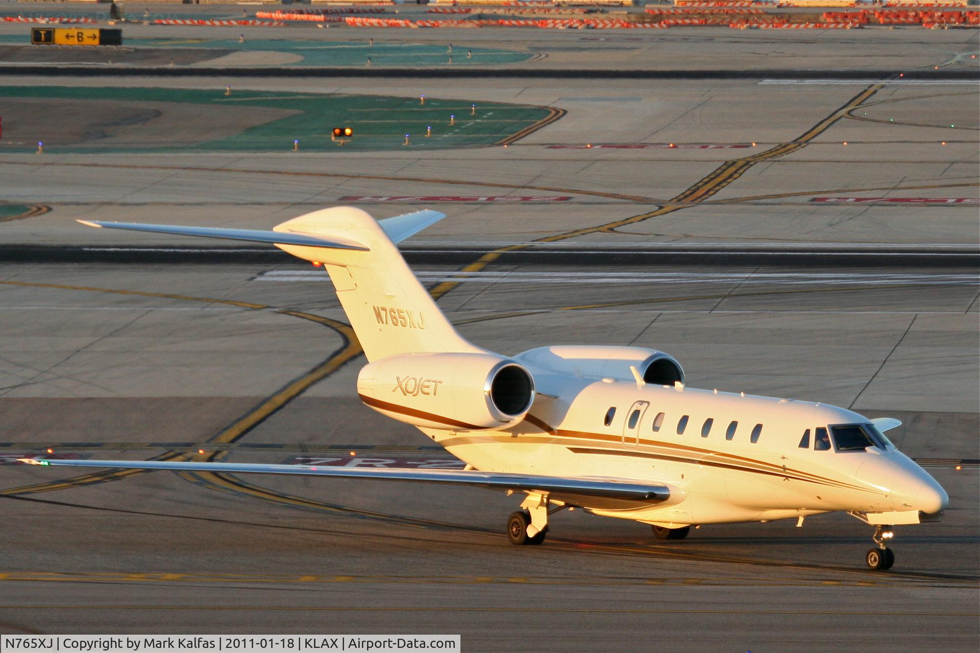 N765XJ, 2006 Cessna 750 Citation X Citation X C/N 750-0265, XOJET Cessna 750 Citation X, XOJET 765 turning onto TWY A KLAX, arriving from KSJC.