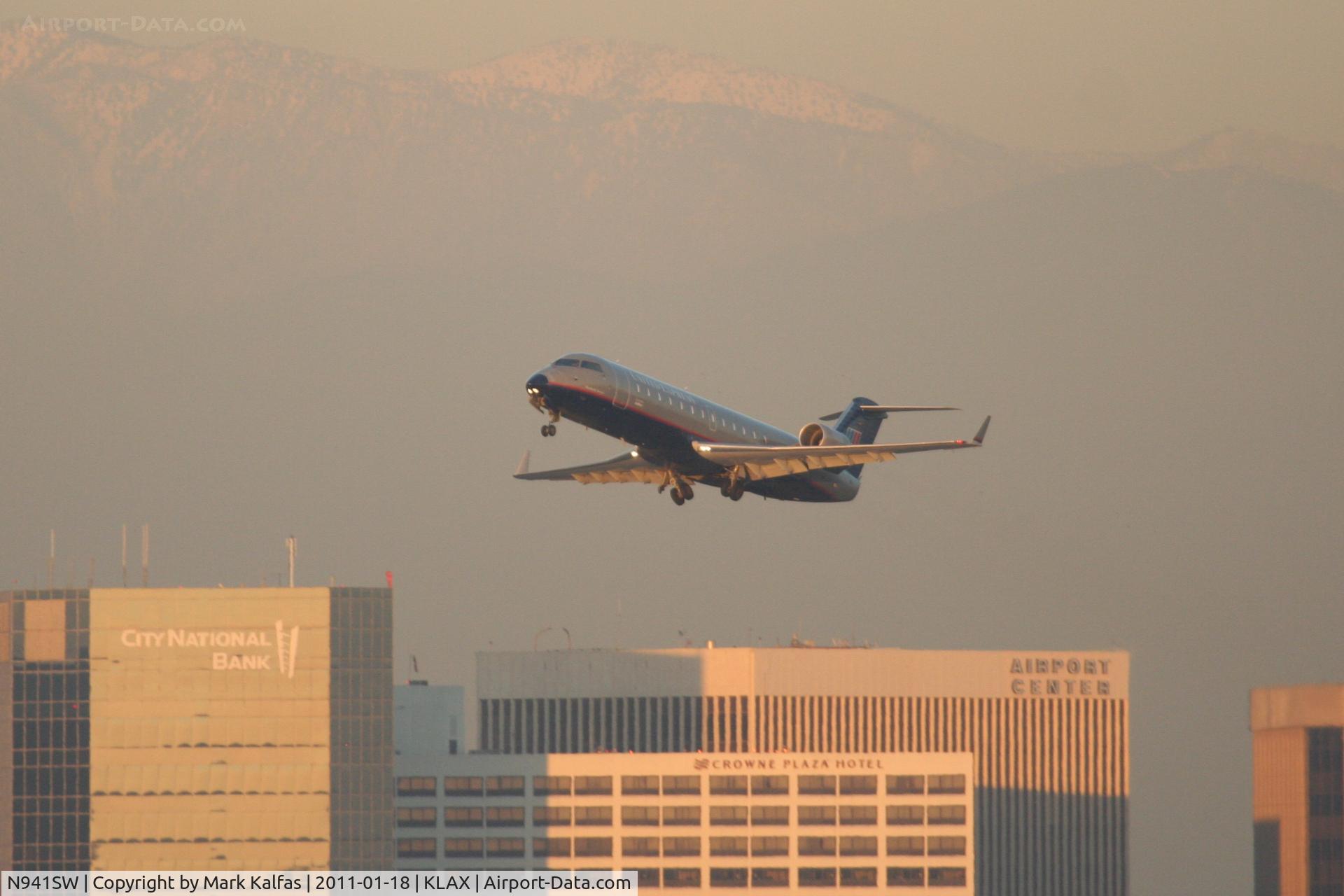 N941SW, 2003 Bombardier CRJ-200LR (CL-600-2B19) C/N 7750, SkyWest/United Express Bombardier CL-600-2B19, departing 25R KLAX enroute to KSMF.