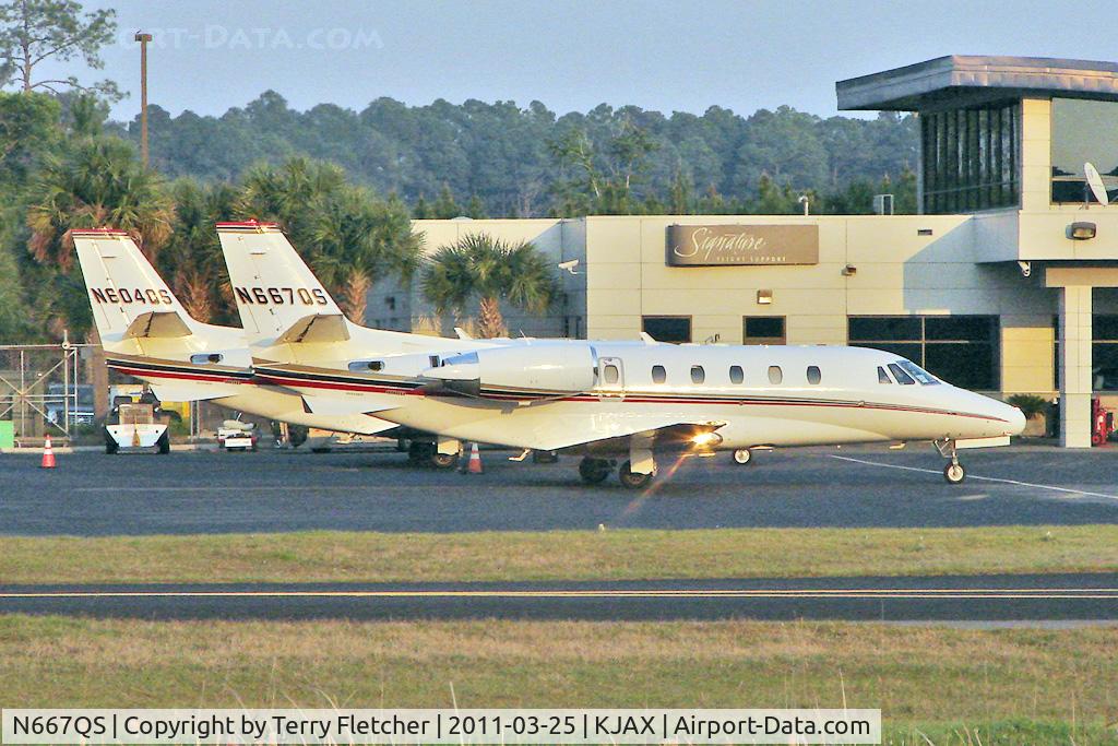 N667QS, 2004 Cessna 560XL Citation Excel C/N 560-5365, 2004 Cessna 560XL, c/n: 560-5365 and sistership N604QS on the Jacksonville In biz ramp in fading light