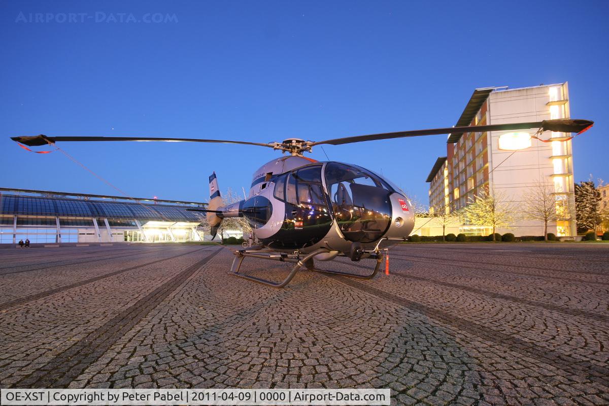OE-XST, Eurocopter EC-120B Colibri C/N 1215, Linz Marathon Heli
parked in front of the Design Center