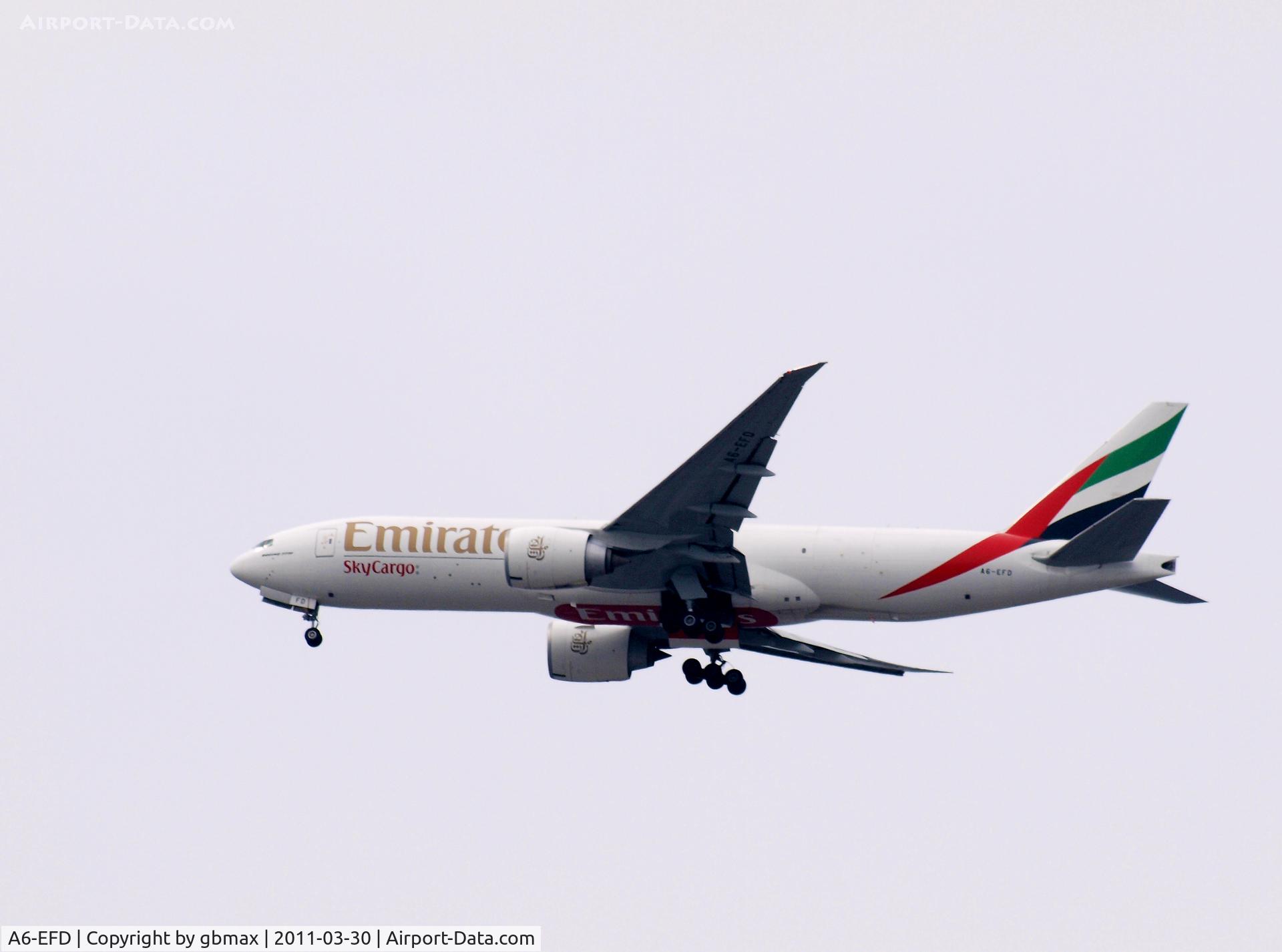 A6-EFD, 2009 Boeing 777-F1H C/N 35606, Flying over Mineola, NY, going to a landing at JFK